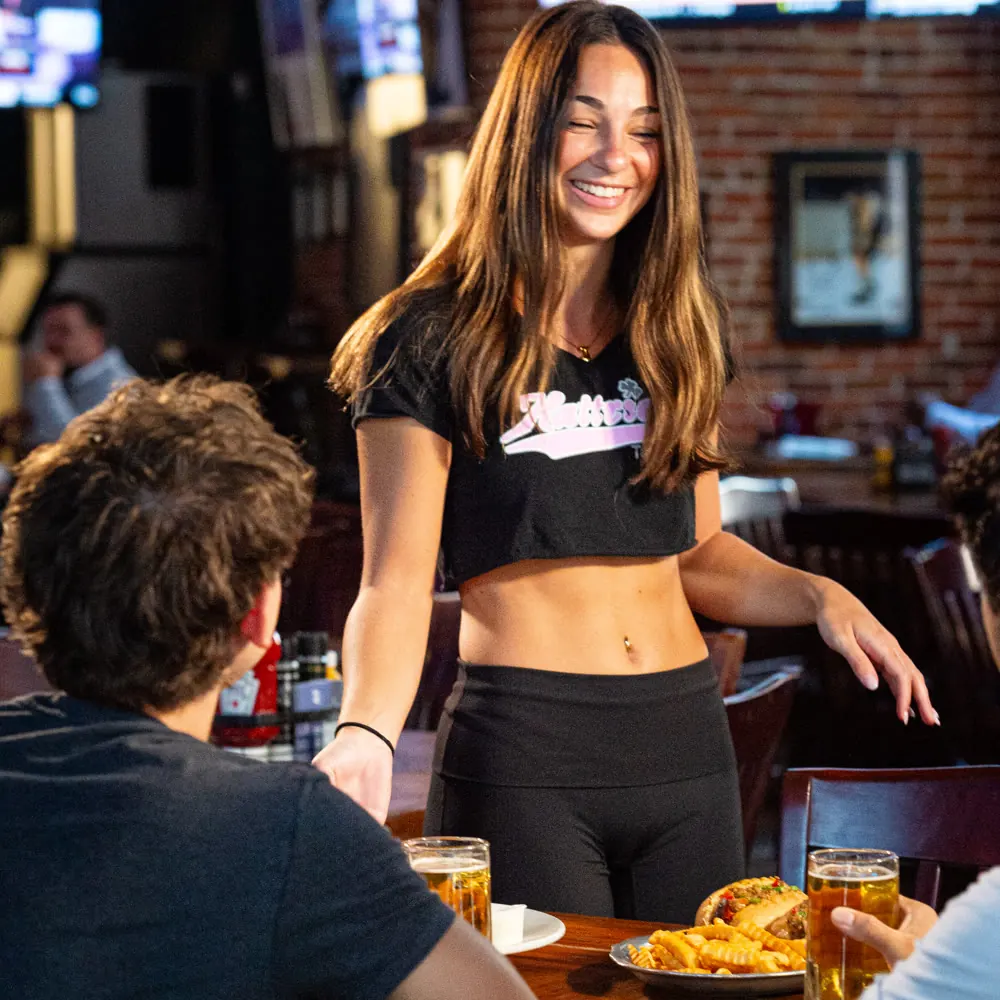 A server bringing food to a table