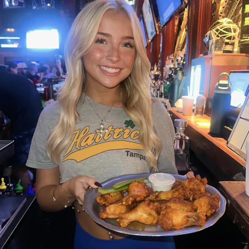 A Hattricks server with a platter of wings