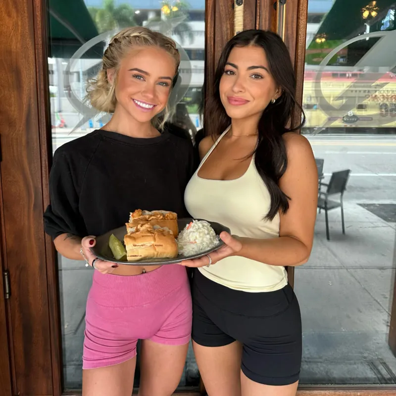 Two Hattricks servers with a shrimp po boy