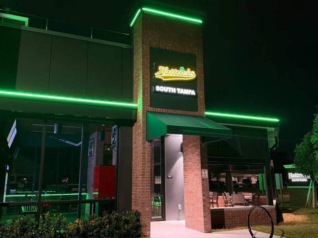 The Hattricks South Tampa entrance at night